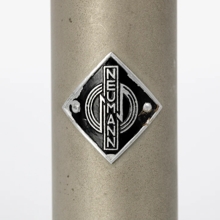 Detailed view of Neumann badge on SM69 microphone body