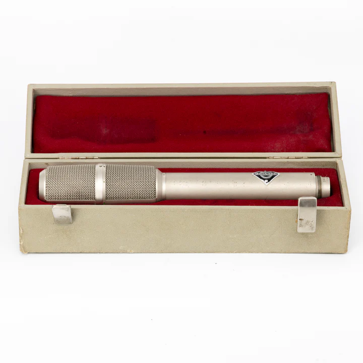 Neumann SM69 tube microphone placed inside its protective storage case with red interior